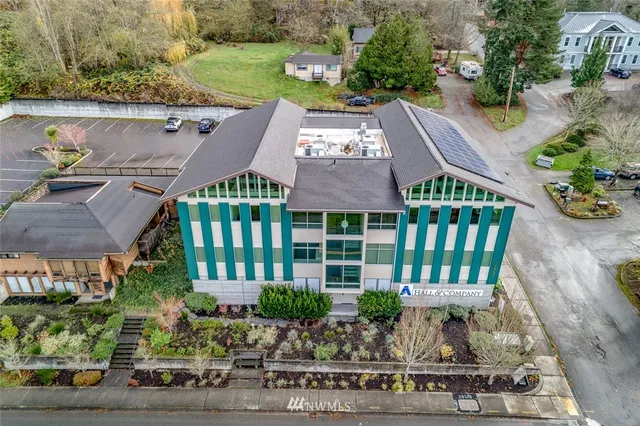 a view of a hallway with wooden shelves