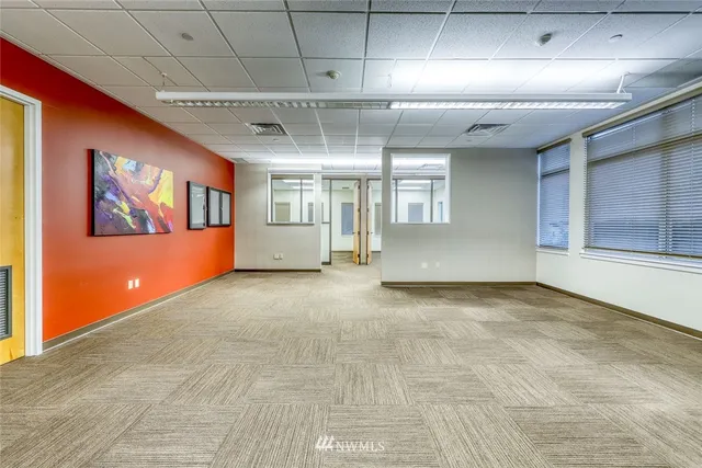 a view of a hallway with wooden shelves