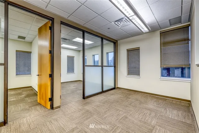 a kitchen with a refrigerator a stove a sink and cabinets