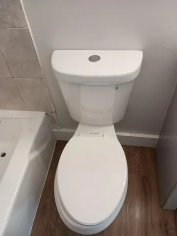 a bathroom with a toilet and a sink