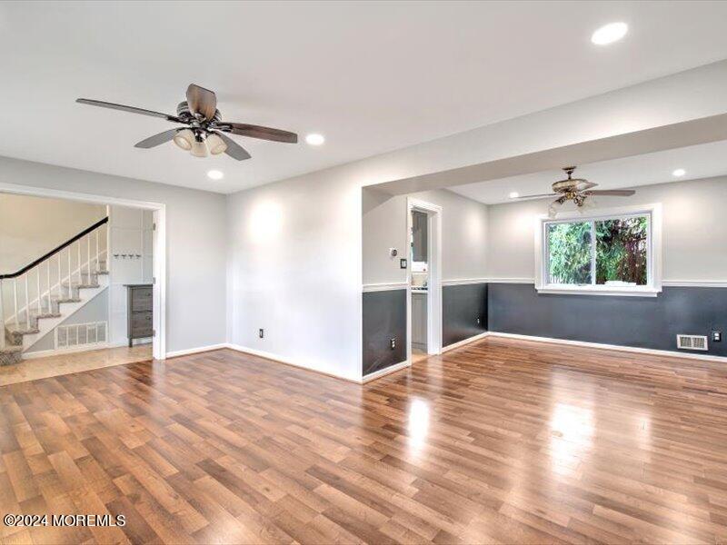 38 Starlight Road Howell, NJ 07731 - Photo 13 of 49 a view of an empty room with window and wooden floor