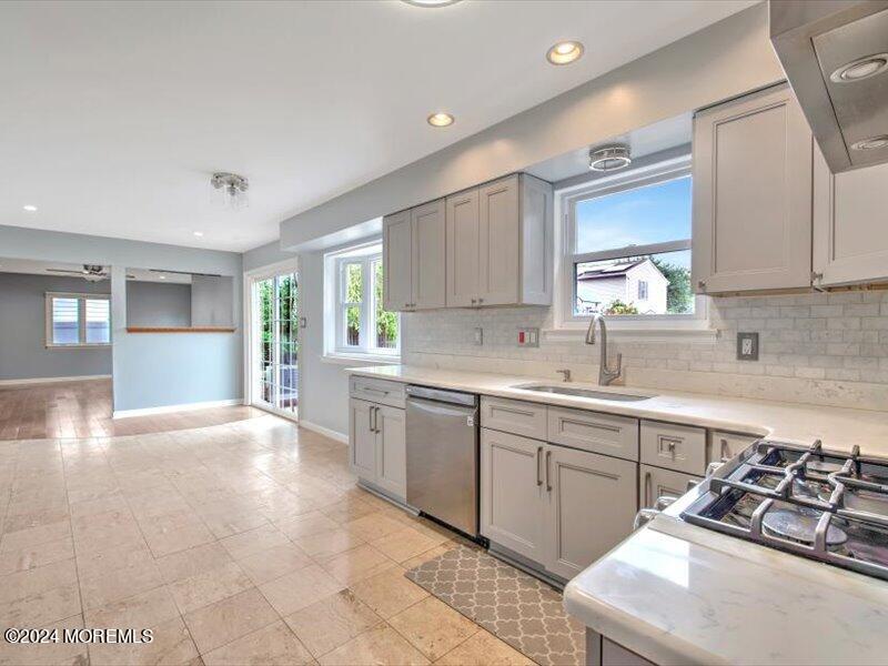 38 Starlight Road Howell, NJ 07731 - Photo 20 of 49 a kitchen with stainless steel appliances a sink stove and cabinets