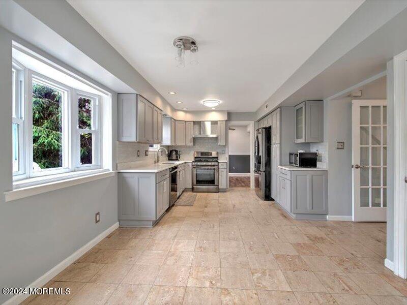 38 Starlight Road Howell, NJ 07731 - Photo 22 of 49 a kitchen with a refrigerator and a sink