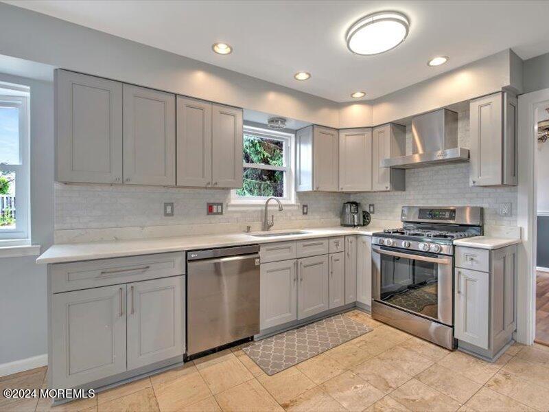 38 Starlight Road Howell, NJ 07731 - Photo 23 of 49 a kitchen with sink cabinets and stainless steel appliances