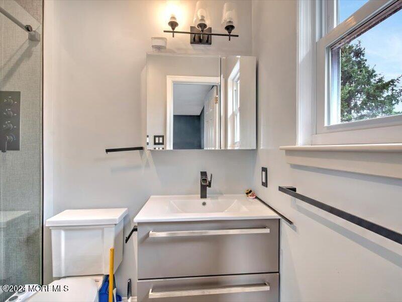 38 Starlight Road Howell, NJ 07731 - Photo 31 of 49 a bathroom with a sink and a mirror