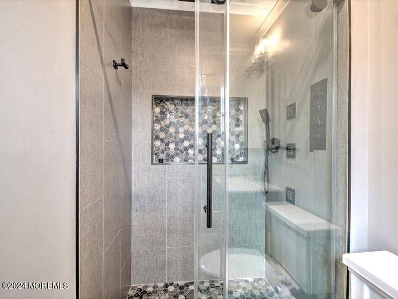 38 Starlight Road Howell, NJ 07731 - Photo 32 of 49 a bathroom with a shower and toilet