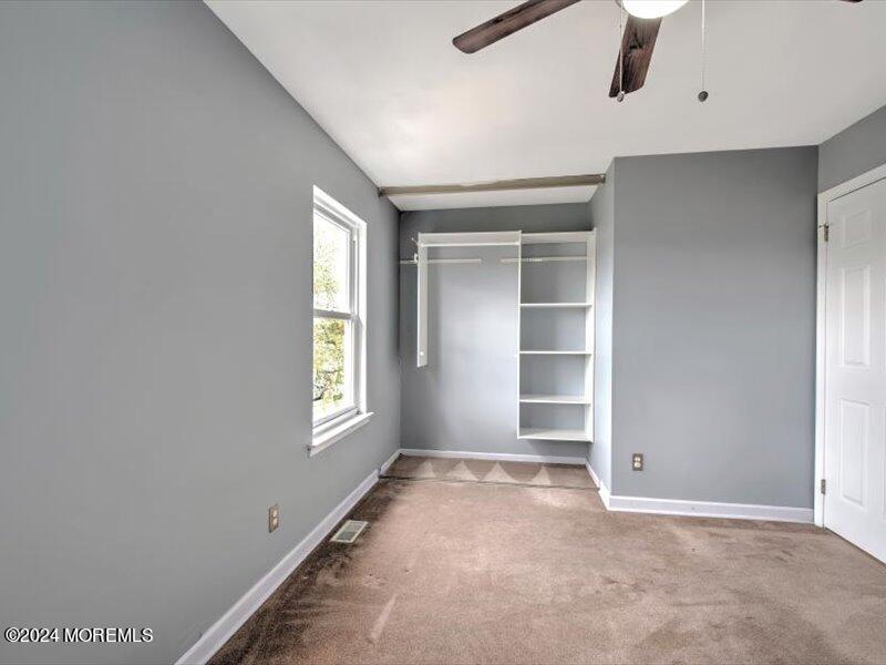 38 Starlight Road Howell, NJ 07731 - Photo 34 of 49 an empty room with a empty space and windows