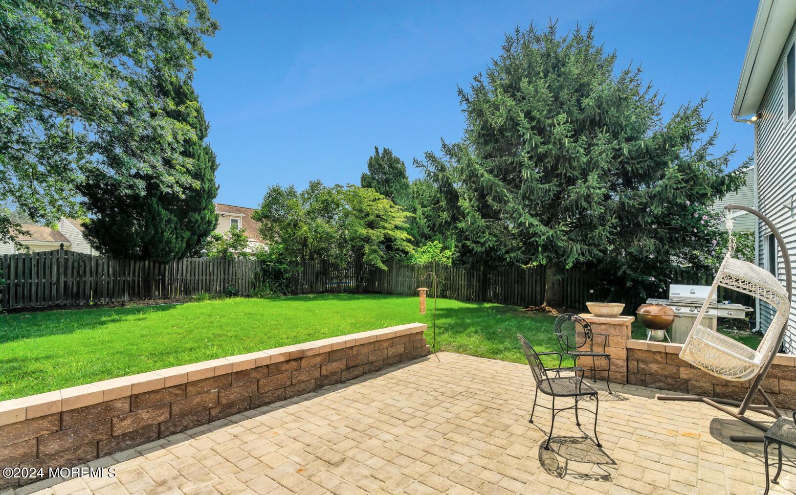 38 Starlight Road Howell, NJ 07731 - Photo 39 of 49 a view of a backyard with sitting area