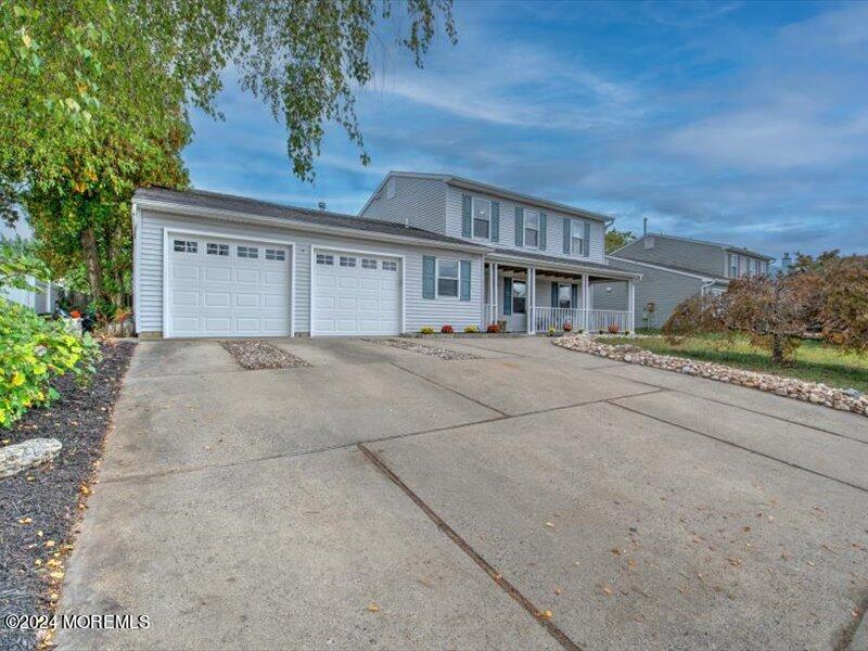 38 Starlight Road Howell, NJ 07731 - Photo 5 of 49 front view of house with a yard