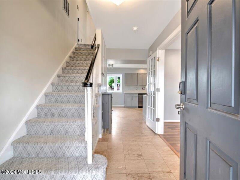 38 Starlight Road Howell, NJ 07731 - Photo 6 of 49 a view of entryway and hall with wooden floor