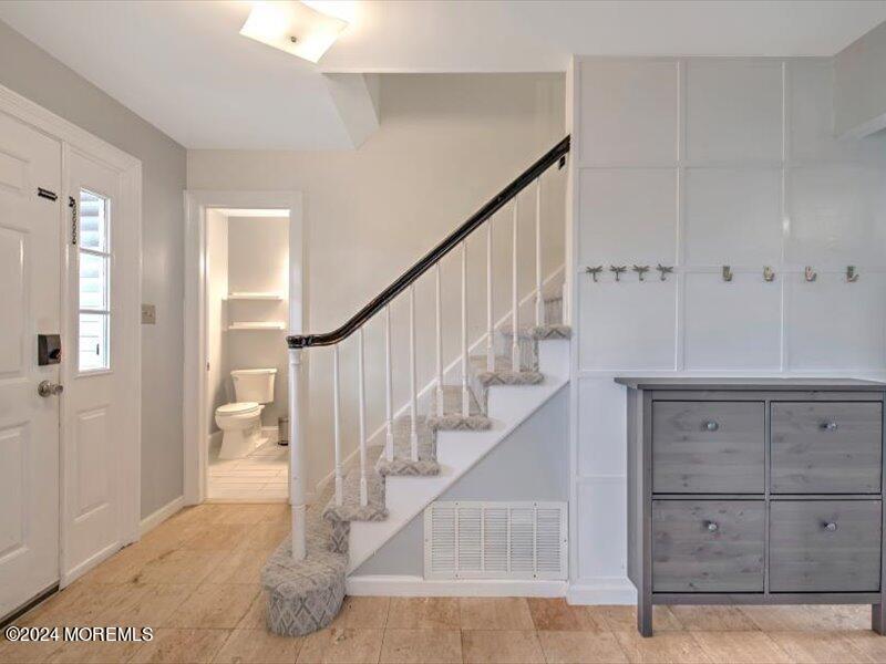 38 Starlight Road Howell, NJ 07731 - Photo 7 of 49 a view of entryway and hall with wooden floor