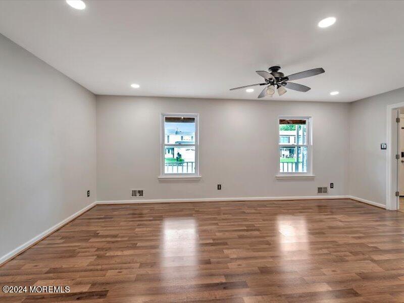 38 Starlight Road Howell, NJ 07731 - Photo 10 of 49 wooden floor in an empty room with a window