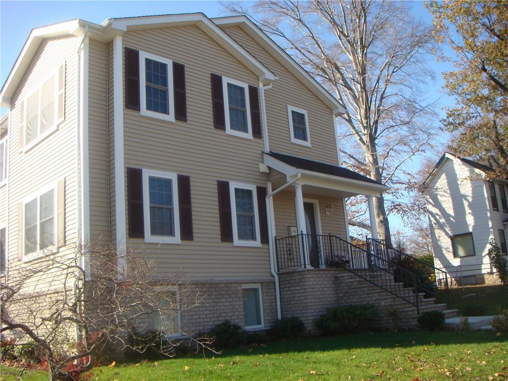 86 Broadway Harrison, NY 10528 - Photo 1 of 1 a front view of a house with garden