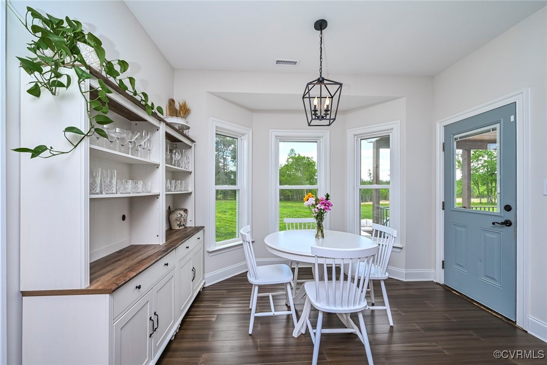 16093 Union Church Road Beaverdam, VA 23015 - Photo 20 of 42 Dining area with dark wood finished floors and bas