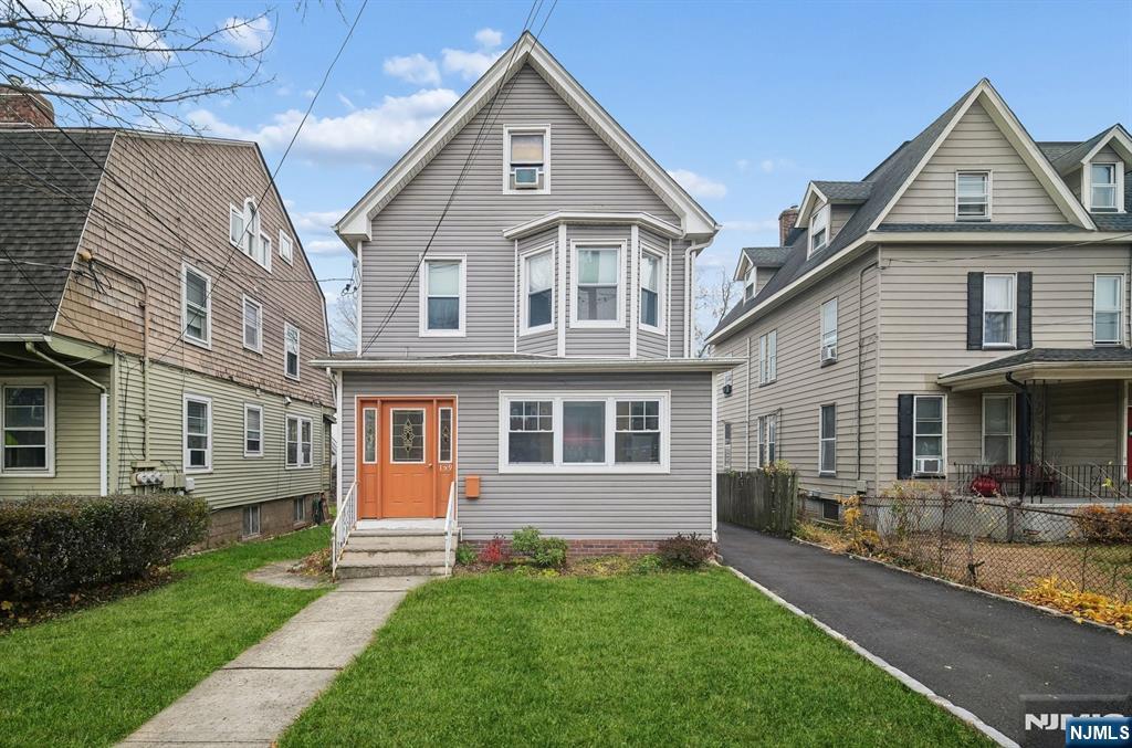 a front view of a house with yard