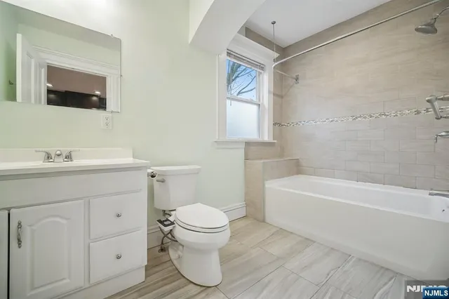 a bathroom with a sink toilet and bathtub