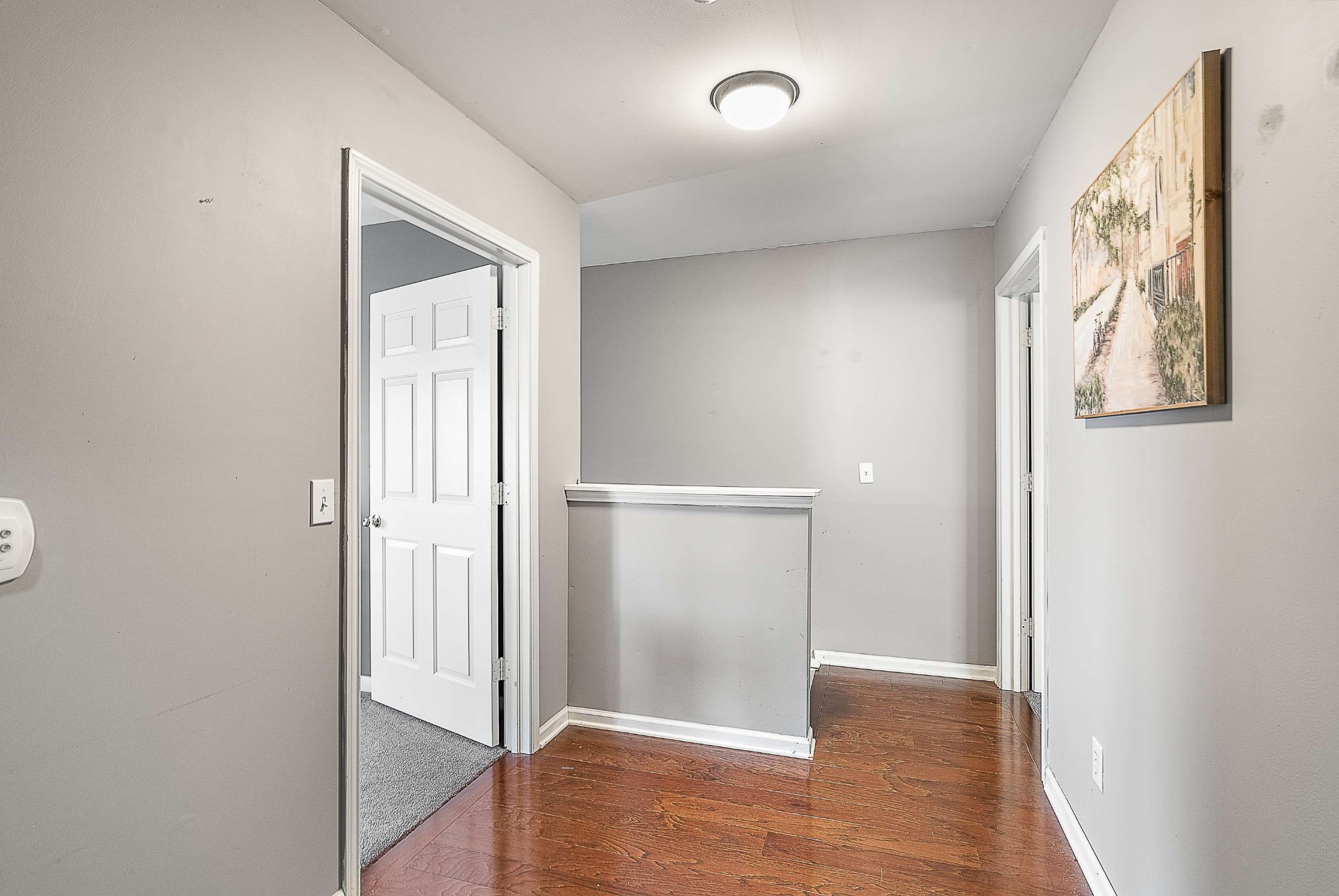 7211 Rye Court Fairview, TN 37062 - Photo 16 of 34 an empty room with wooden floor mirror and windows