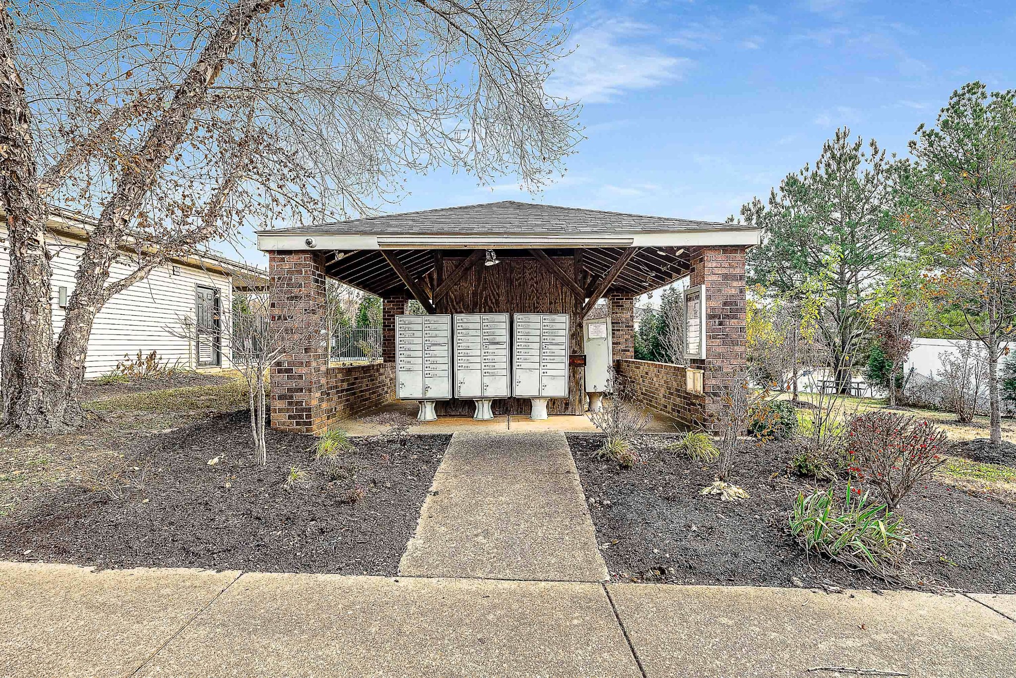 7211 Rye Court Fairview, TN 37062 - Photo 20 of 34 a view of a patio with a table and chairs under an umbrella