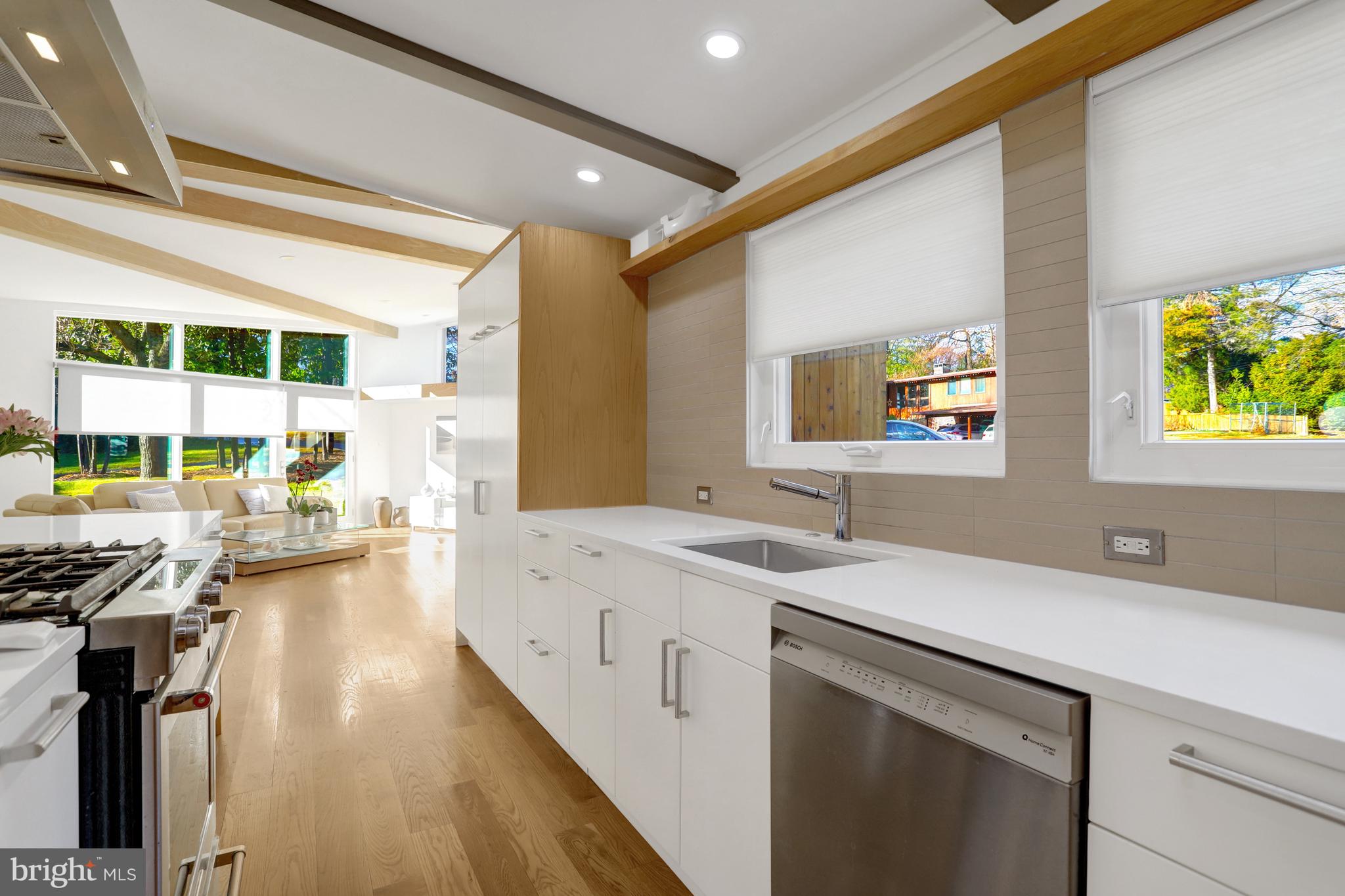 3017 Pine Spring Road Falls Church, VA 22042 - Photo 11 of 62 a kitchen with a sink stove and cabinets