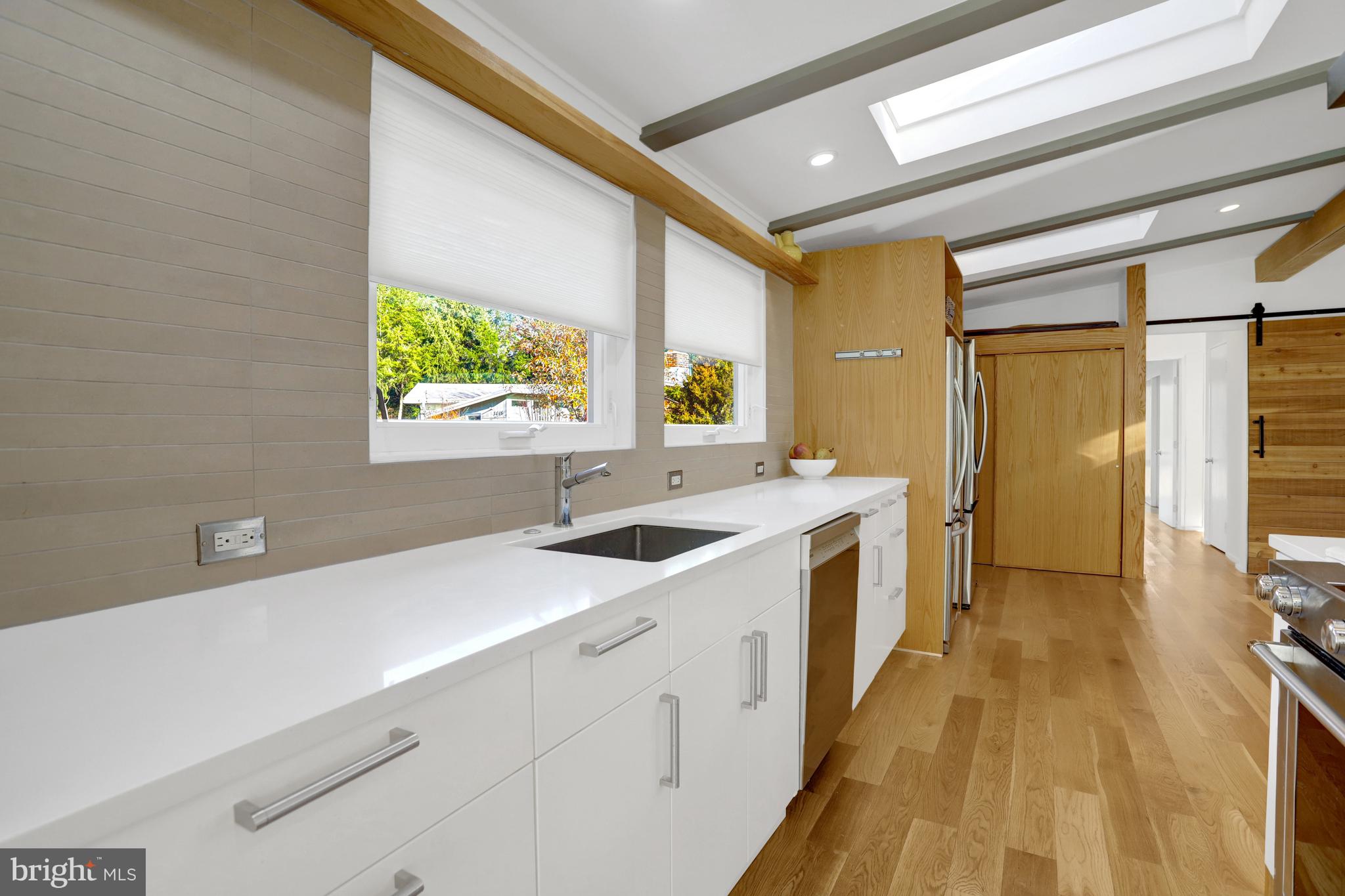 3017 Pine Spring Road Falls Church, VA 22042 - Photo 12 of 62 a spacious bathroom with a double vanity sink and a large mirror