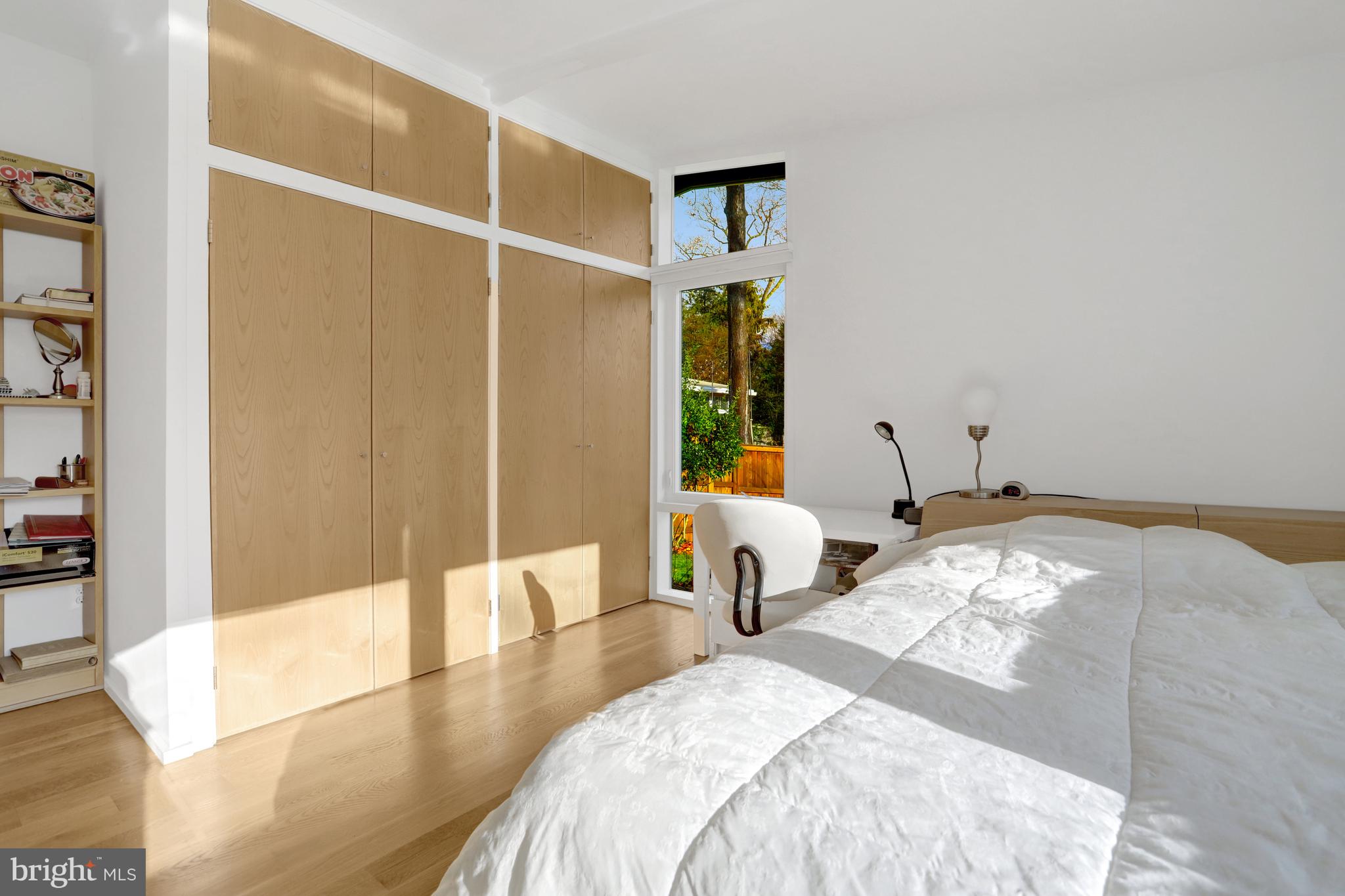 3017 Pine Spring Road Falls Church, VA 22042 - Photo 28 of 62 a bedroom with a bed and wooden floor