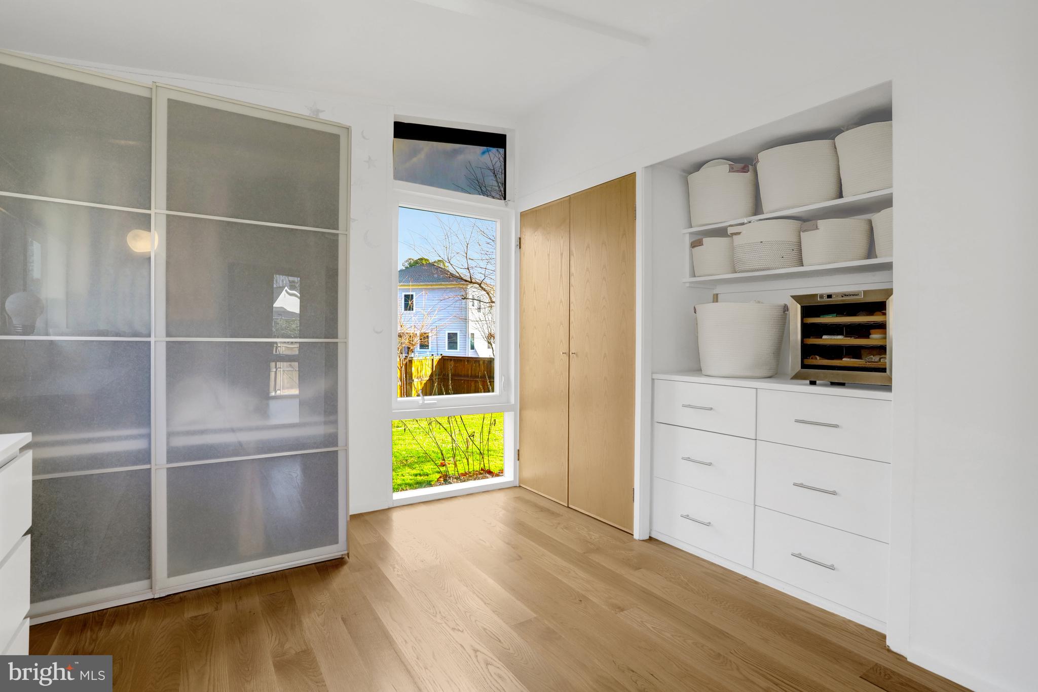 3017 Pine Spring Road Falls Church, VA 22042 - Photo 30 of 62 a room with walk in closet and wooden floor