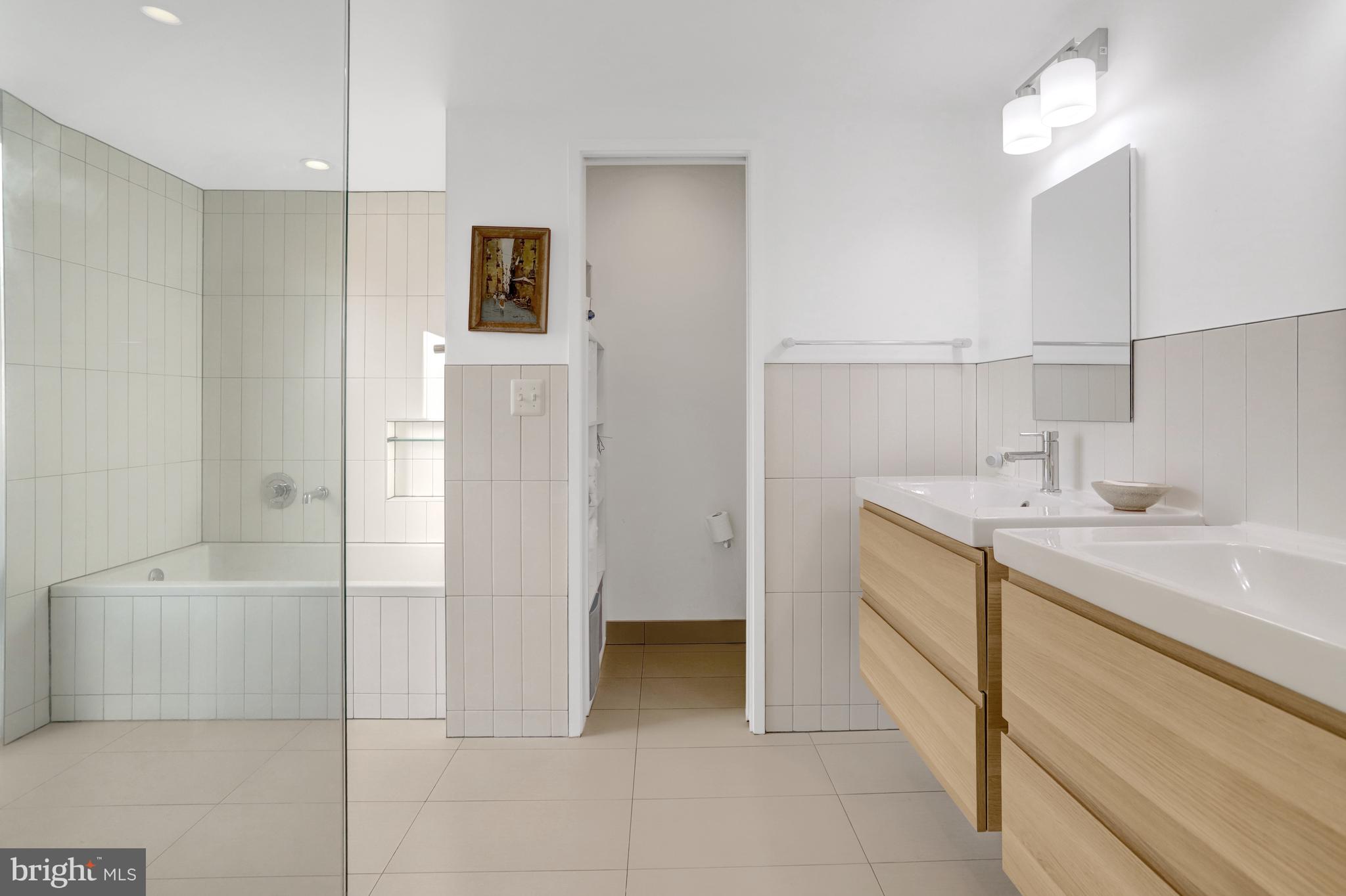 3017 Pine Spring Road Falls Church, VA 22042 - Photo 43 of 62 a bathroom with a sink a toilet and shower