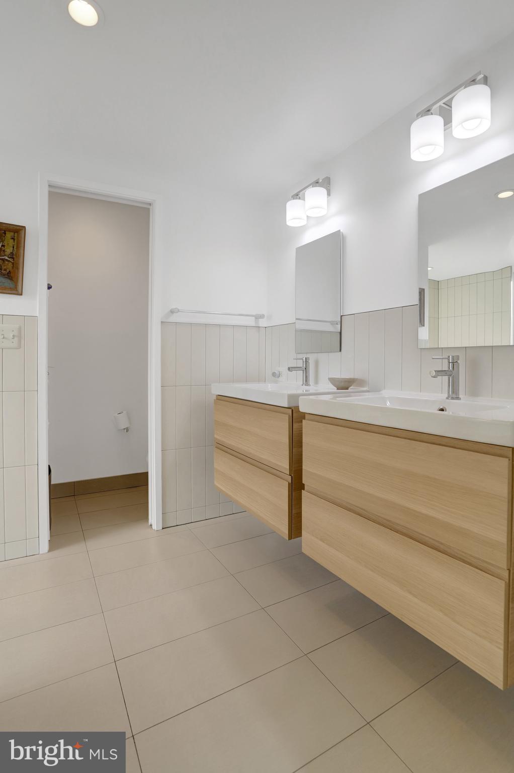 3017 Pine Spring Road Falls Church, VA 22042 - Photo 44 of 62 a bathroom with a sink and a mirror