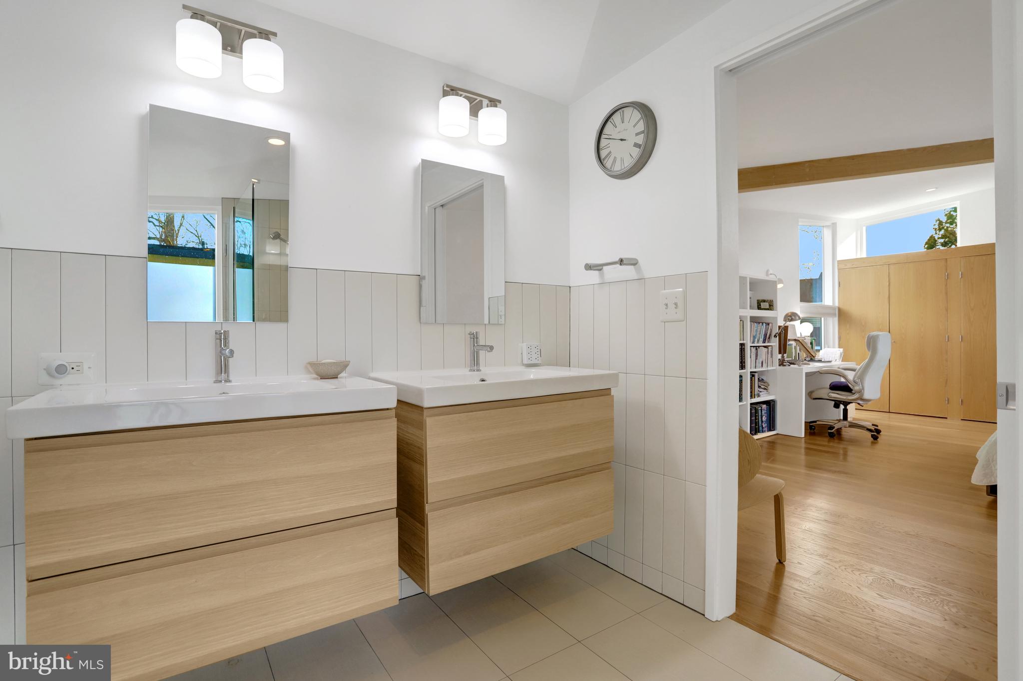 3017 Pine Spring Road Falls Church, VA 22042 - Photo 47 of 62 a bathroom with a sink a mirror and a shower