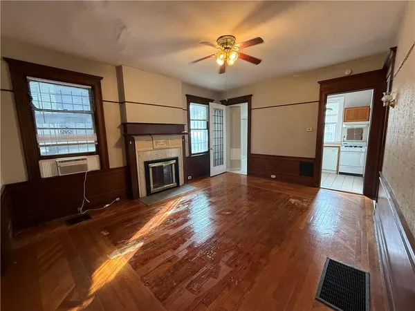 a living room with fireplace furniture and a flat screen tv