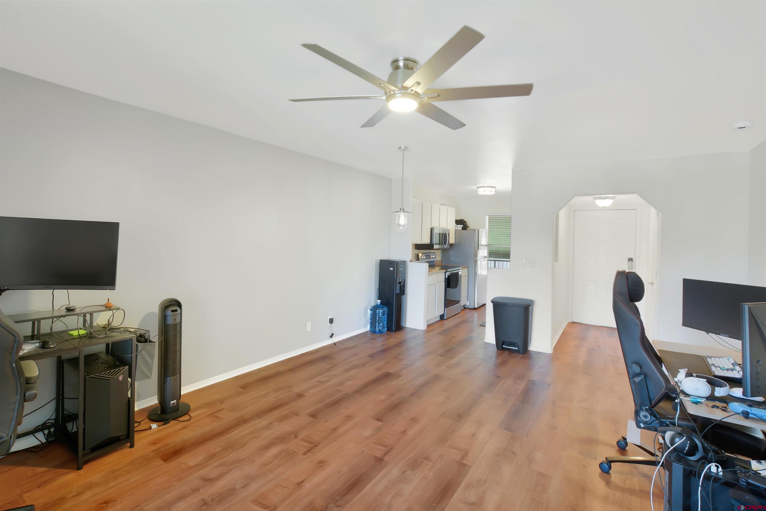 1100 Goeglein Gulch Road, Unit 223 Durango, CO 81301 - Photo 1 of 25 a view of a workspace with furniture and wooden floor