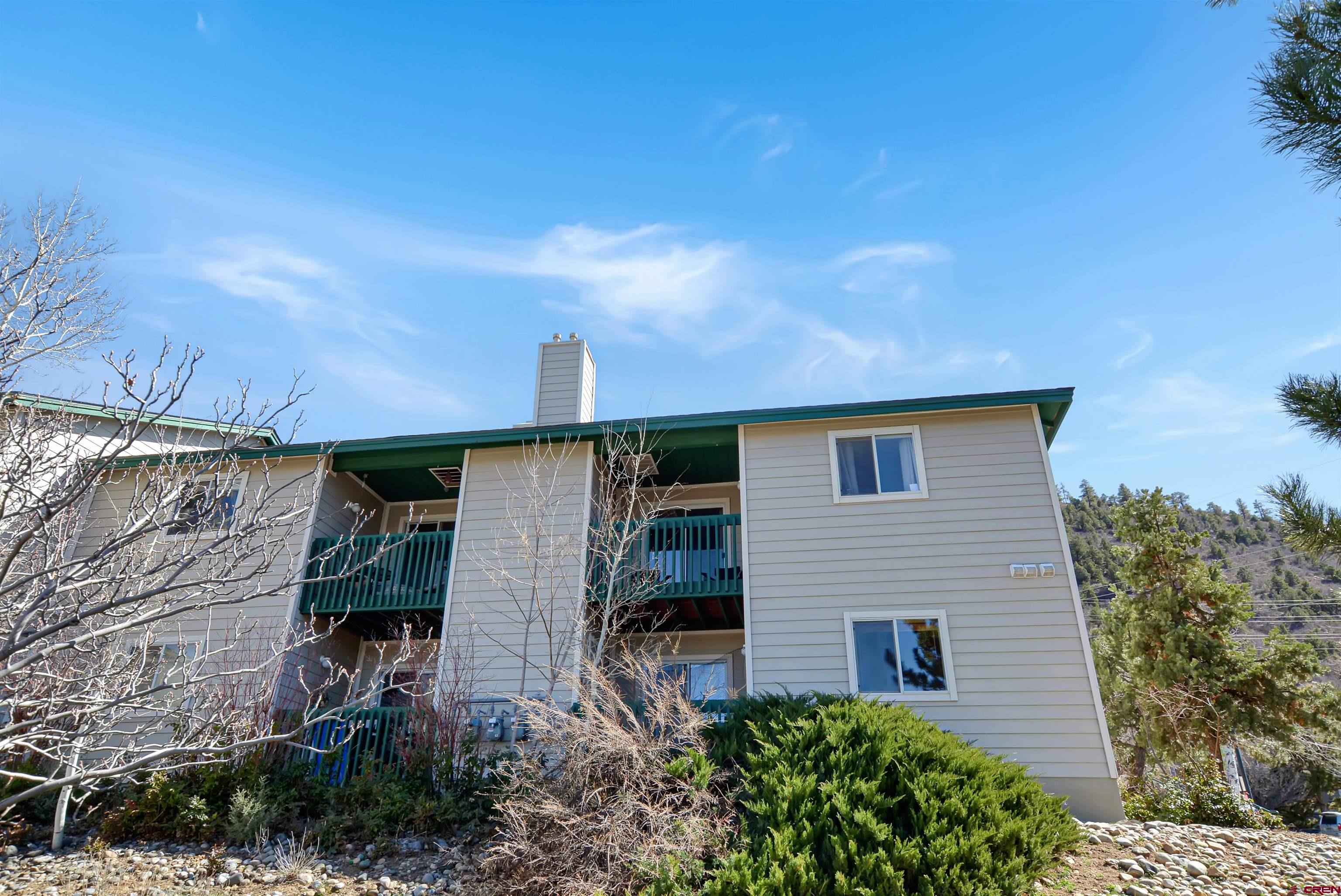 1100 Goeglein Gulch Road, Unit 223 Durango, CO 81301 - Photo 22 of 25 a backyard of a house with lots of green space