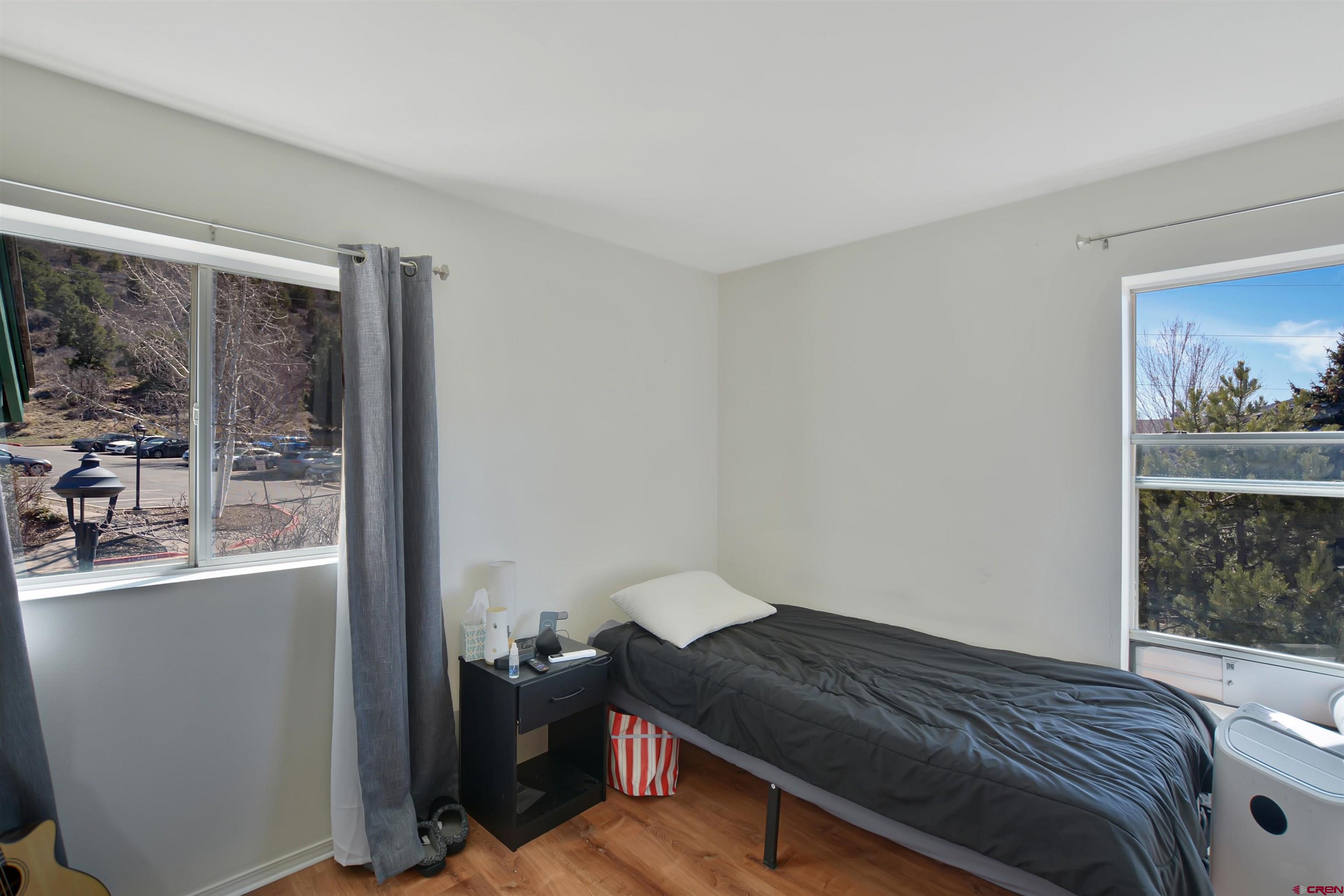 1100 Goeglein Gulch Road, Unit 223 Durango, CO 81301 - Photo 5 of 25 a bedroom with a bed and a window