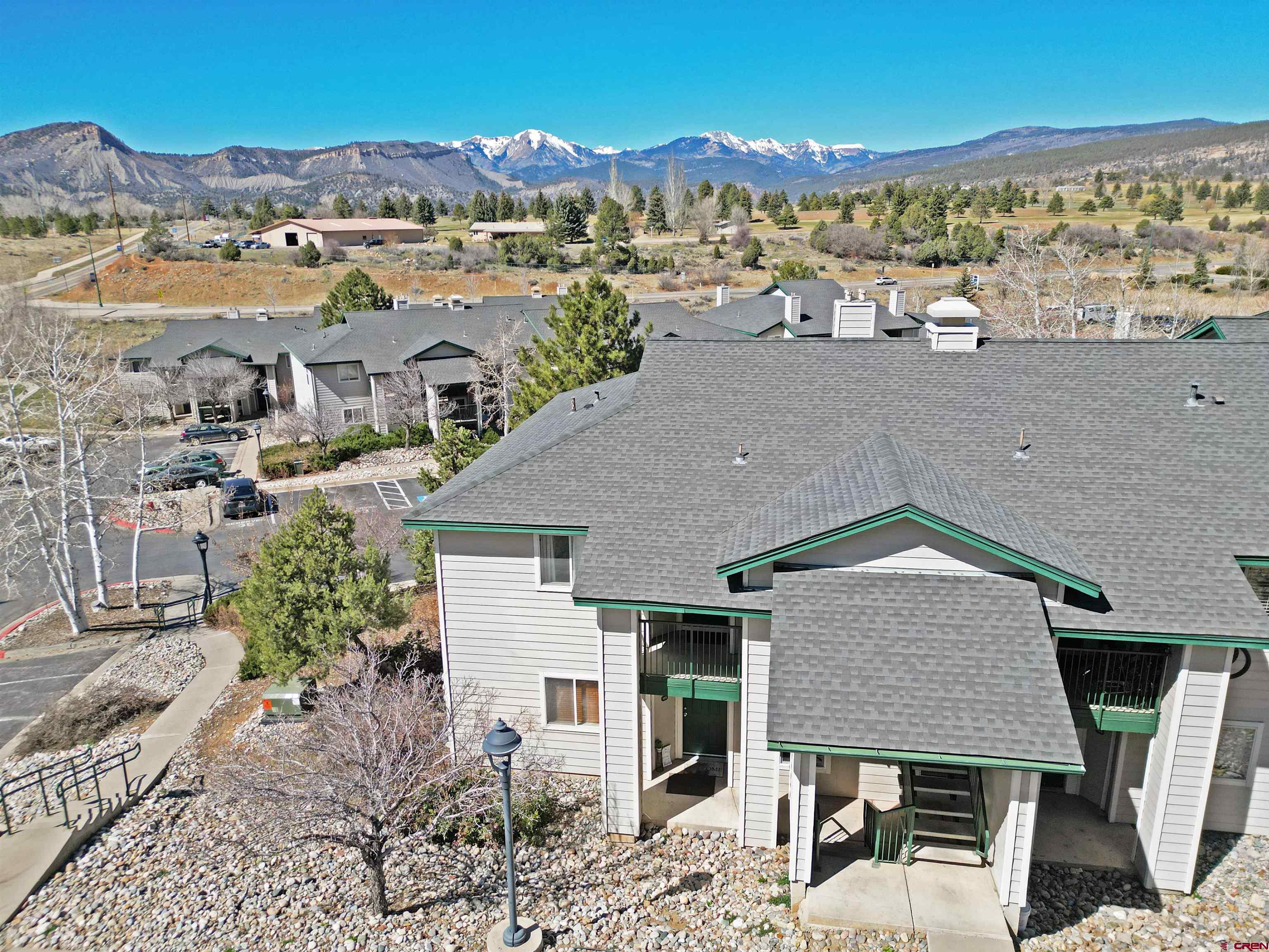 1100 Goeglein Gulch Road, Unit 223 Durango, CO 81301 - Photo 8 of 25 an aerial view of a house with a yard and lake view