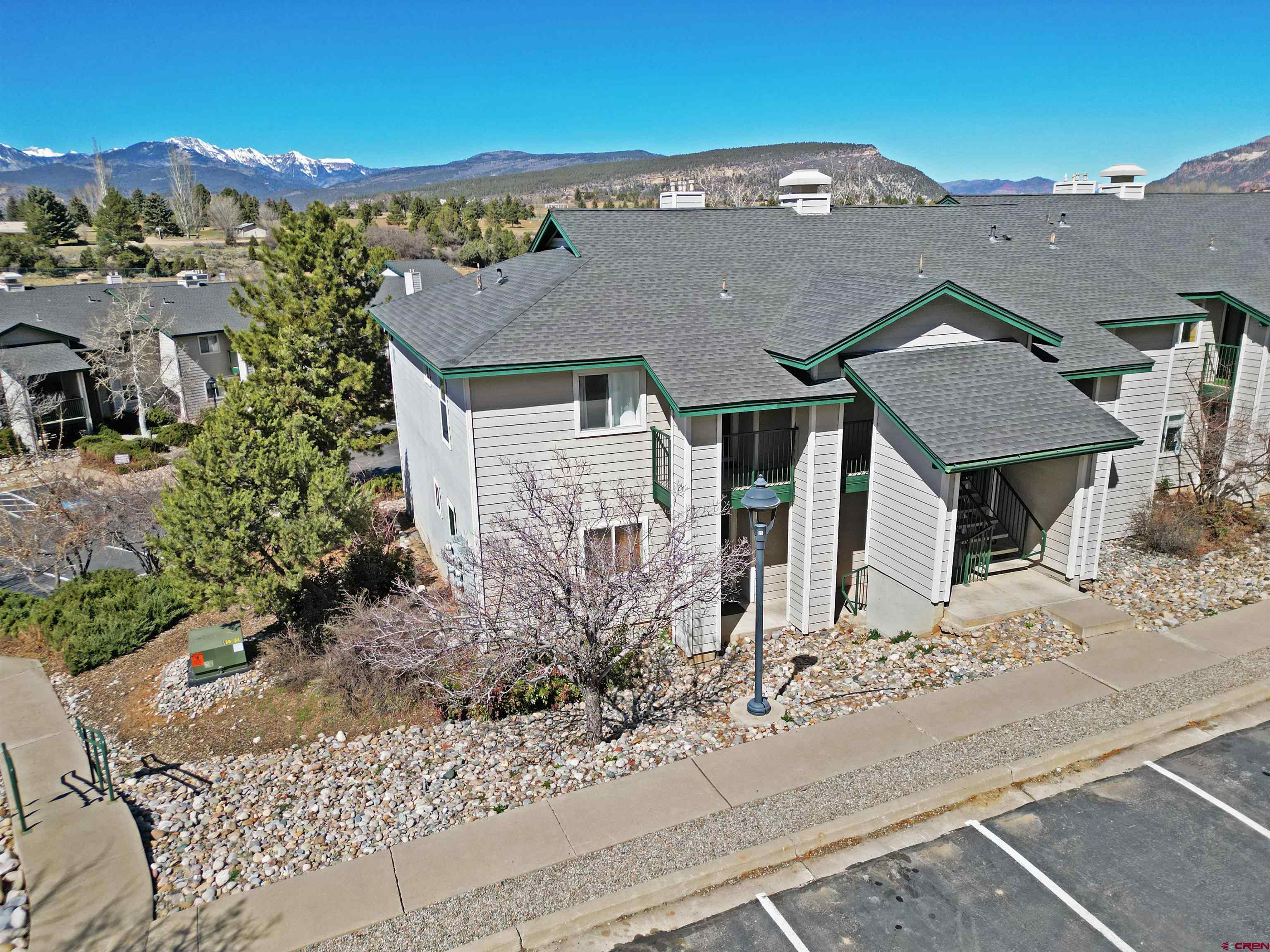 1100 Goeglein Gulch Road, Unit 223 Durango, CO 81301 - Photo 9 of 25 front view of a house with a bench