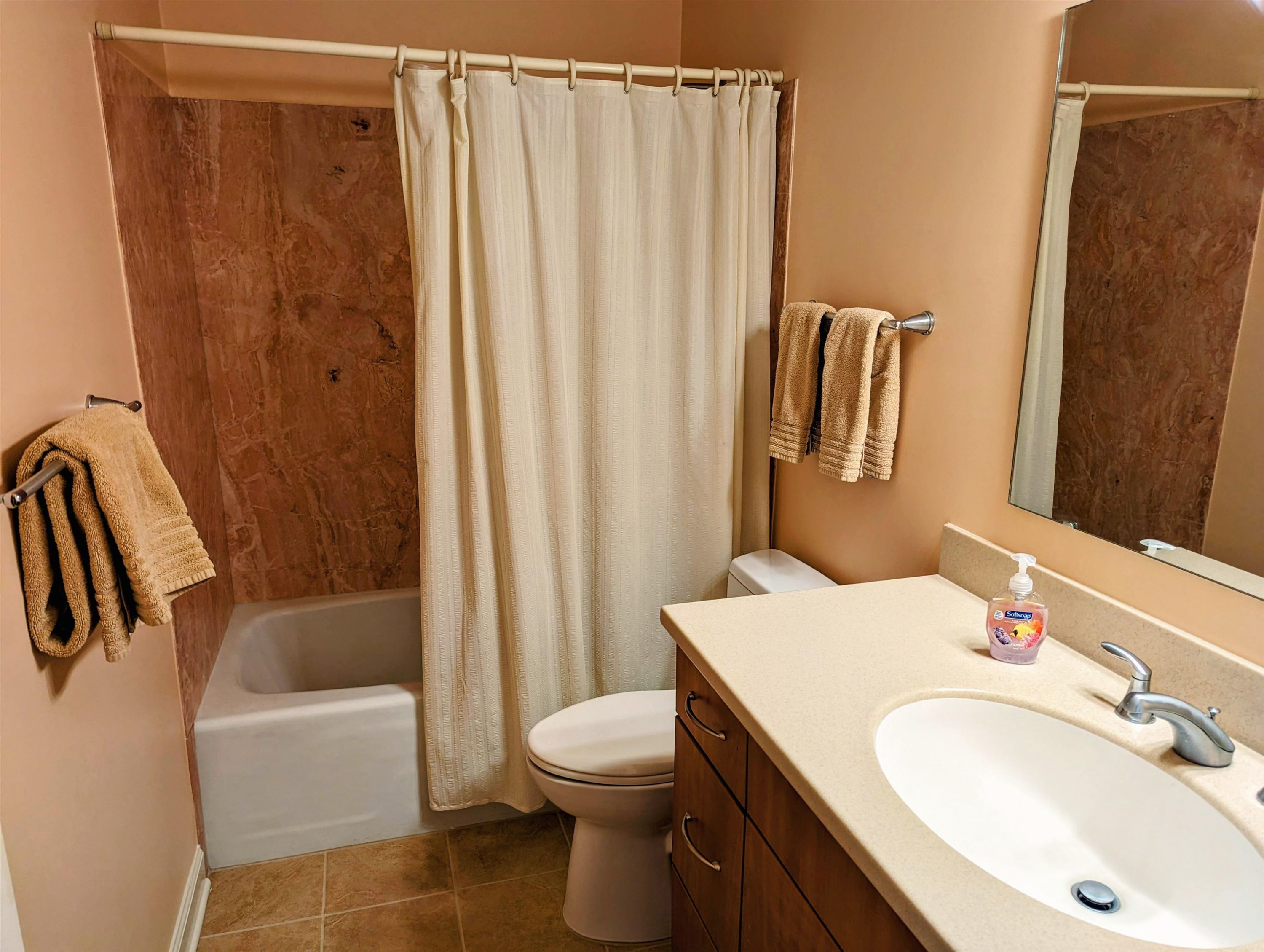 4503 Malvern Road Durham, NC 27707 - Photo 28 of 37 Hall bathroom upstairs has been renovated with Hi-Macs solid surface counters, comfort height vanity, comfort height toilet, and cultured marble surround for tub. Hall Bathroom