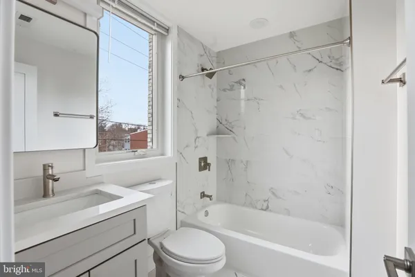 a view of kitchen with furniture and wooden floor