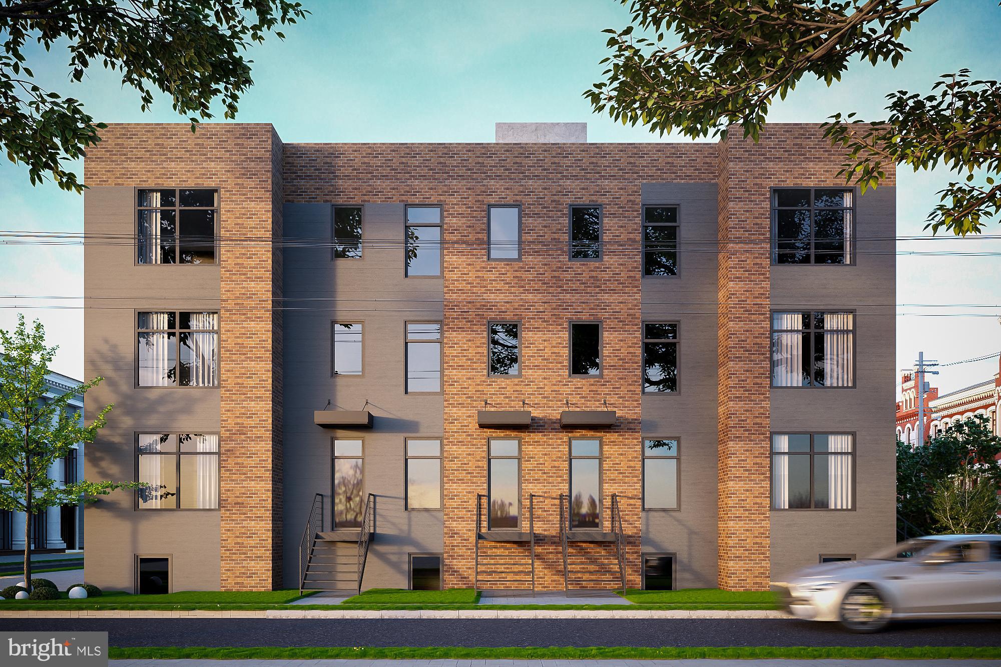 2602 4th Street Northeast, Unit B Washington, DC 20002 - Photo 2 of 3 a front view of a residential apartment building with a yard