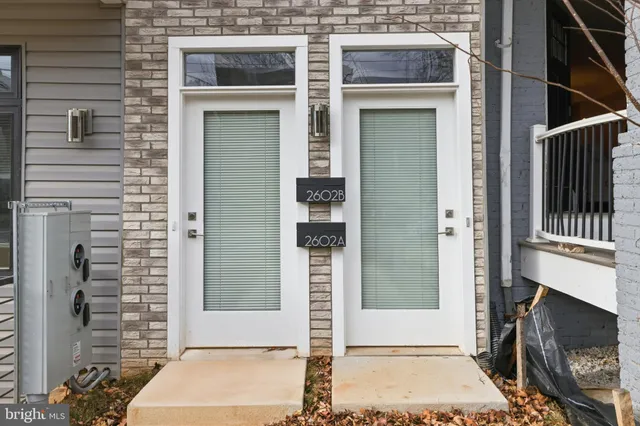 a kitchen with stainless steel appliances granite countertop a stove microwave and sink