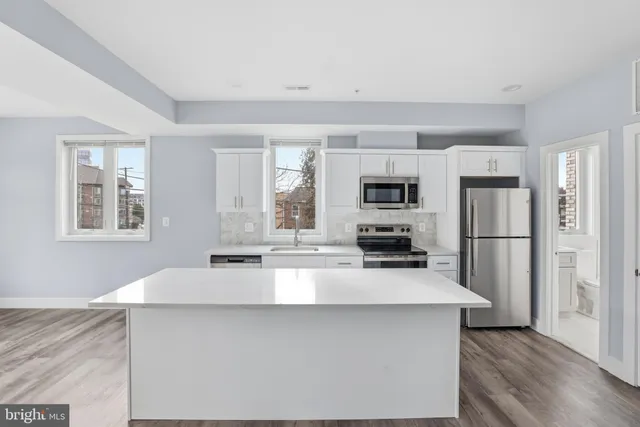 a picture of a bench in a white building