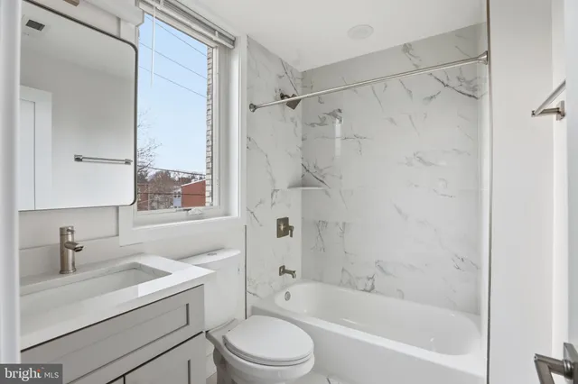 a view of kitchen with furniture and wooden floor