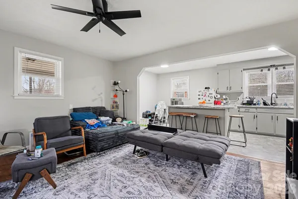 a living room with furniture and a rug