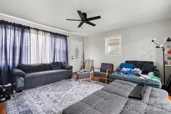 a living room with furniture and a window