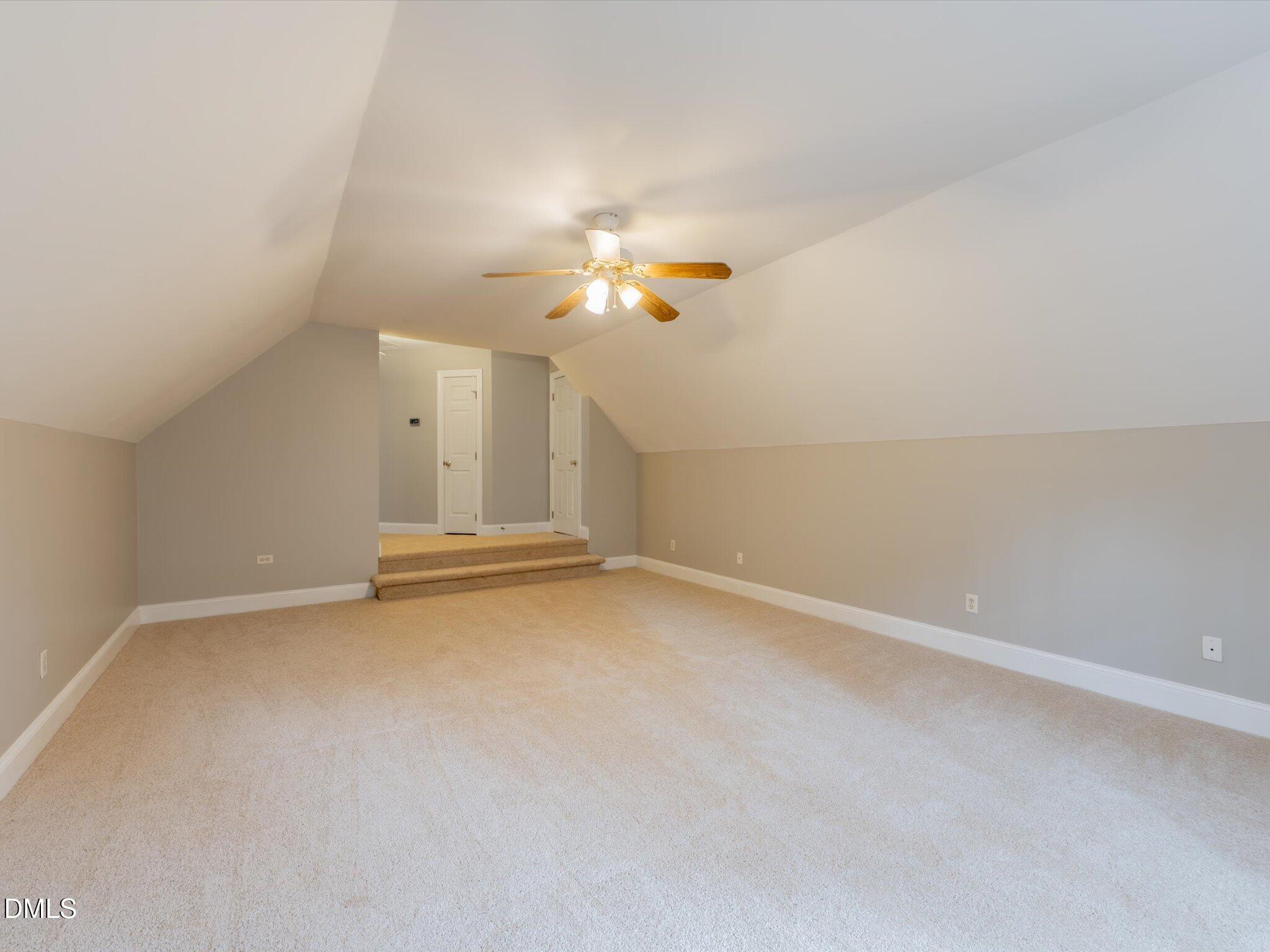 6832 Cool Pond Road Raleigh, NC 27613 - Photo 16 of 27 an empty room with a ceiling fan and window