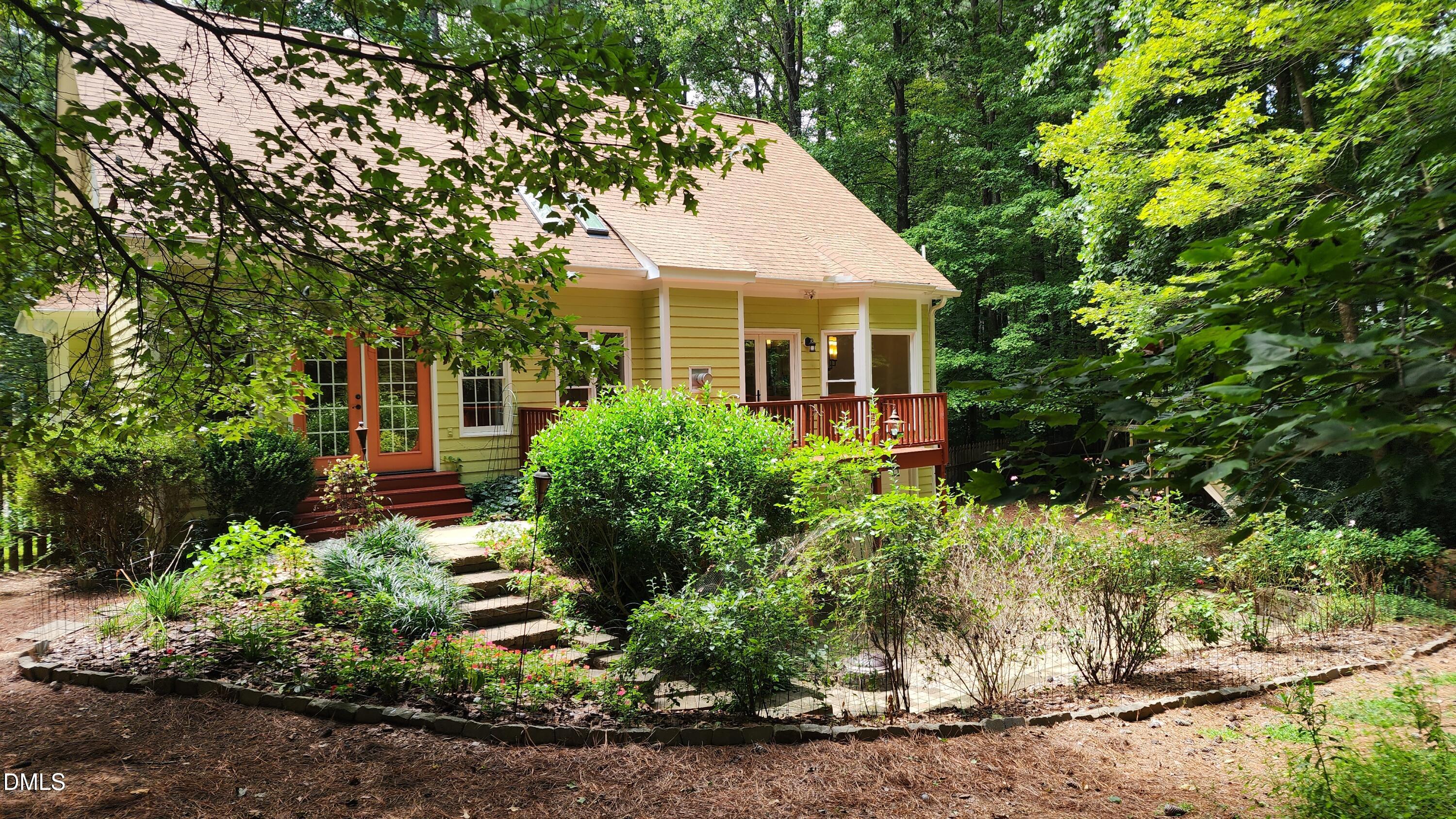 6832 Cool Pond Road Raleigh, NC 27613 - Photo 17 of 27 a front view of a house with a yard