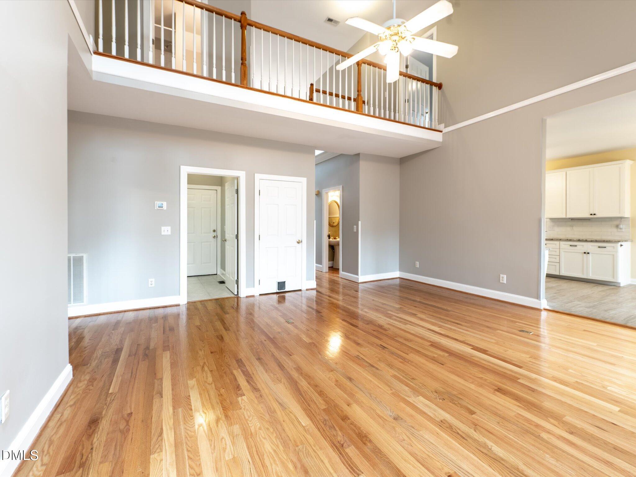 6832 Cool Pond Road Raleigh, NC 27613 - Photo 4 of 27 a view of a room with wooden floor and staircase