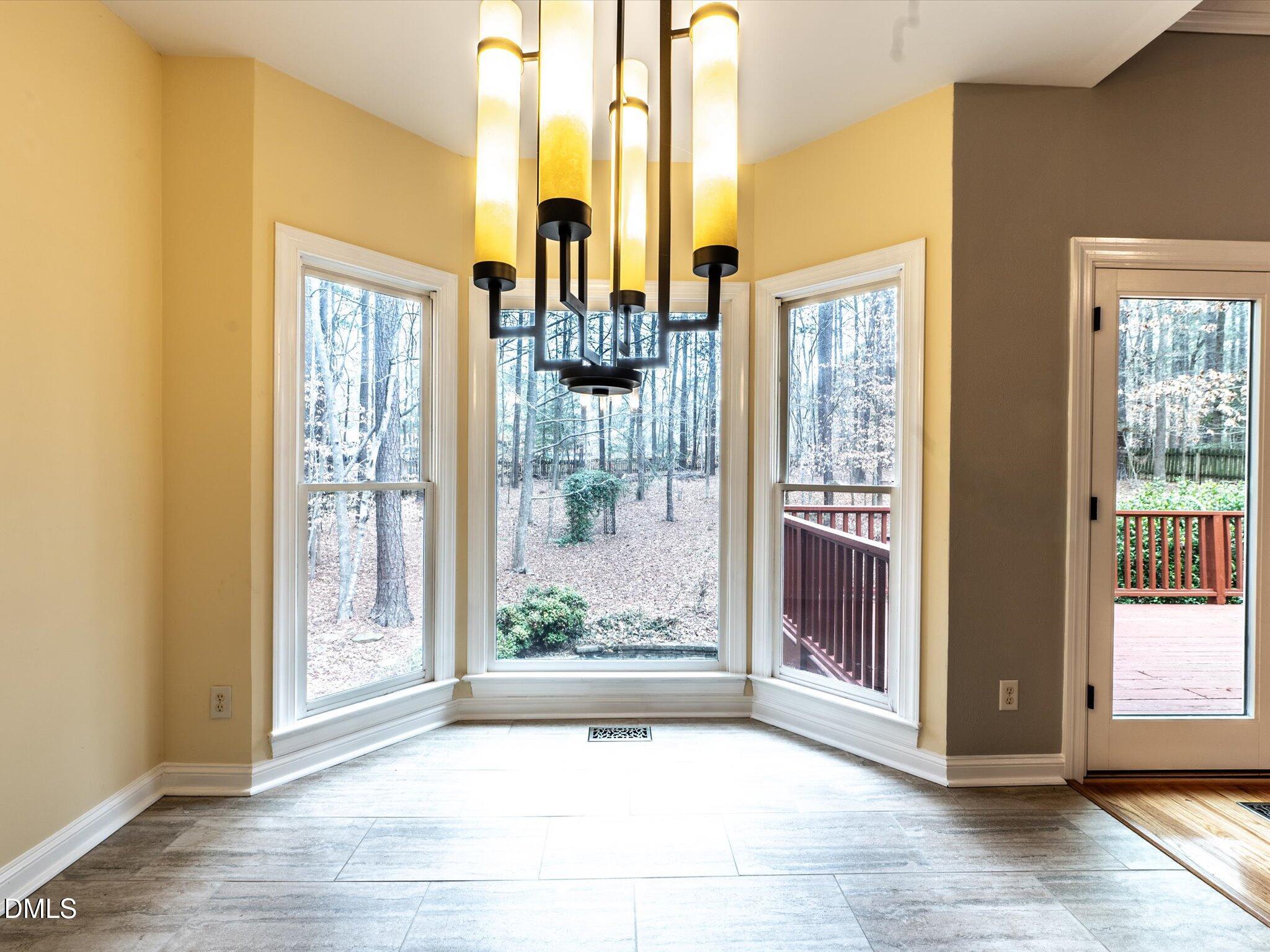 6832 Cool Pond Road Raleigh, NC 27613 - Photo 6 of 27 a view of a entryway door and an empty room