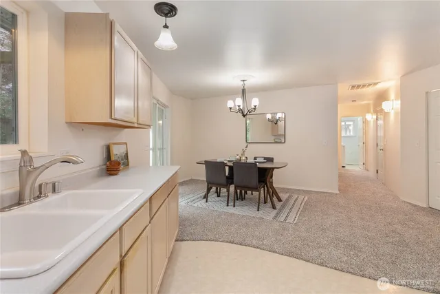 a view of a kitchen and dining table