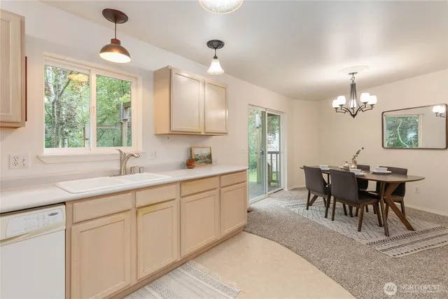 a kitchen with center island table and chairs in it
