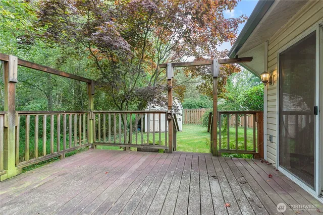 a view of balcony with wooden floor